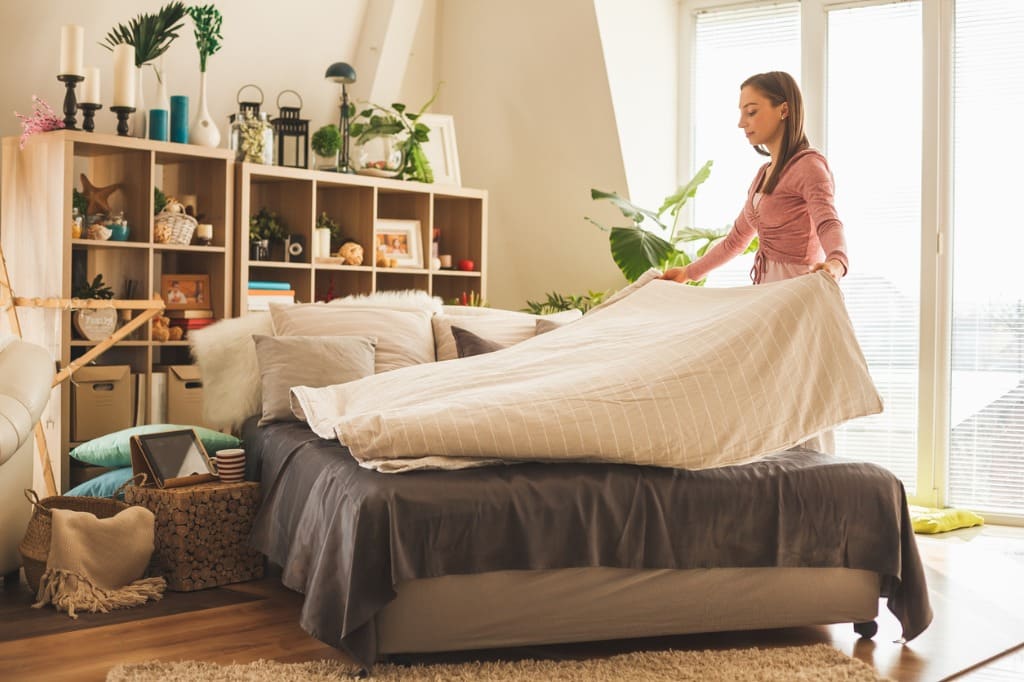 woman-making-bed