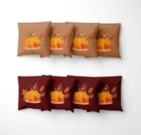 Fall Harvest cornhole Bags with image of pumpkin and autumn leaves on them