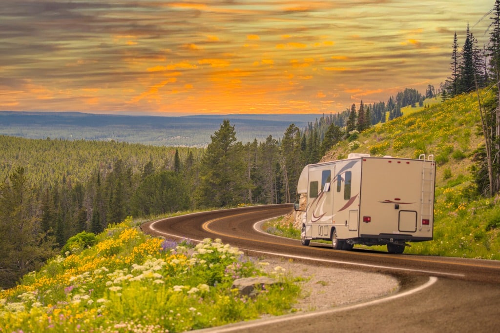 camper-driving-down-winding-road